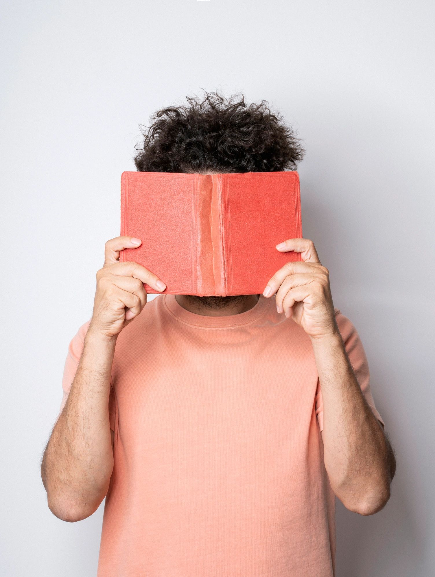 Author holding a book