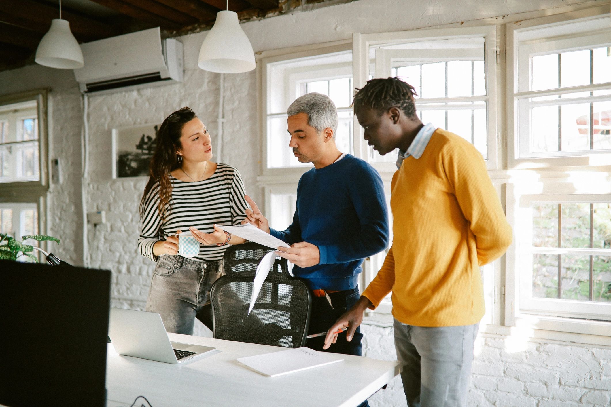 Publishing and design professionals collaborating in a modern office