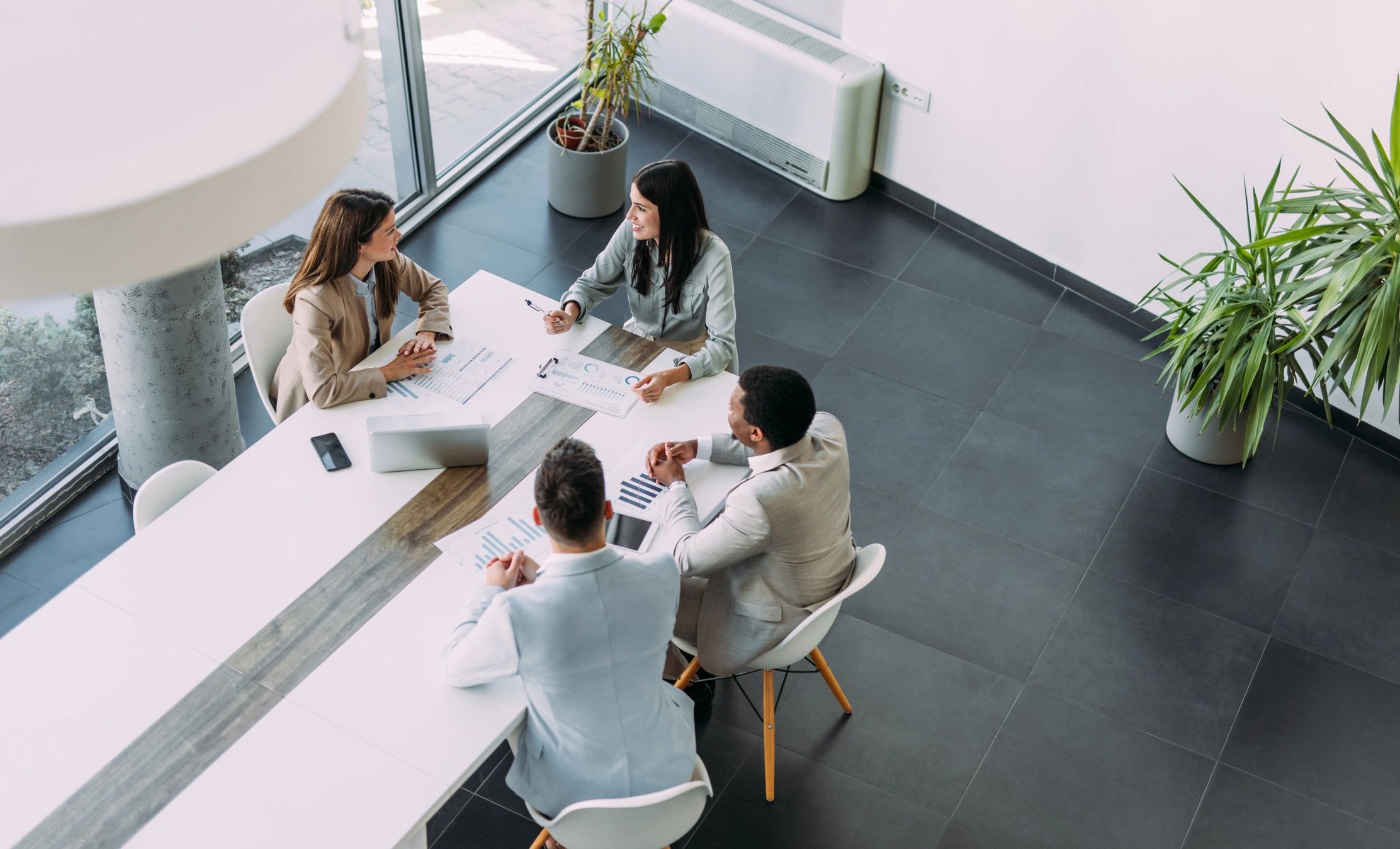 Publishing team gathered around a table in a collaborative editorial meeting