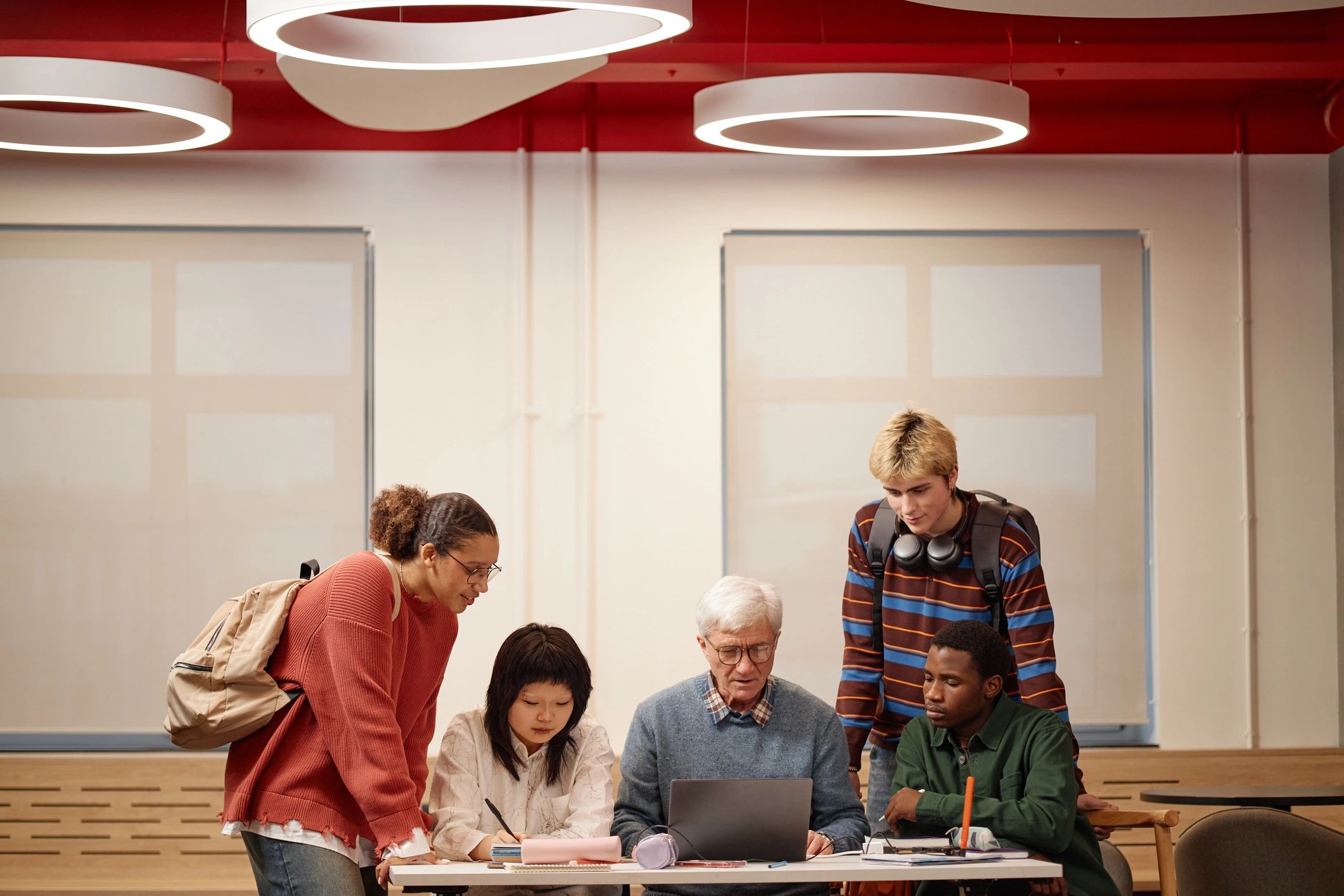 Publishing team collaborating around a desk