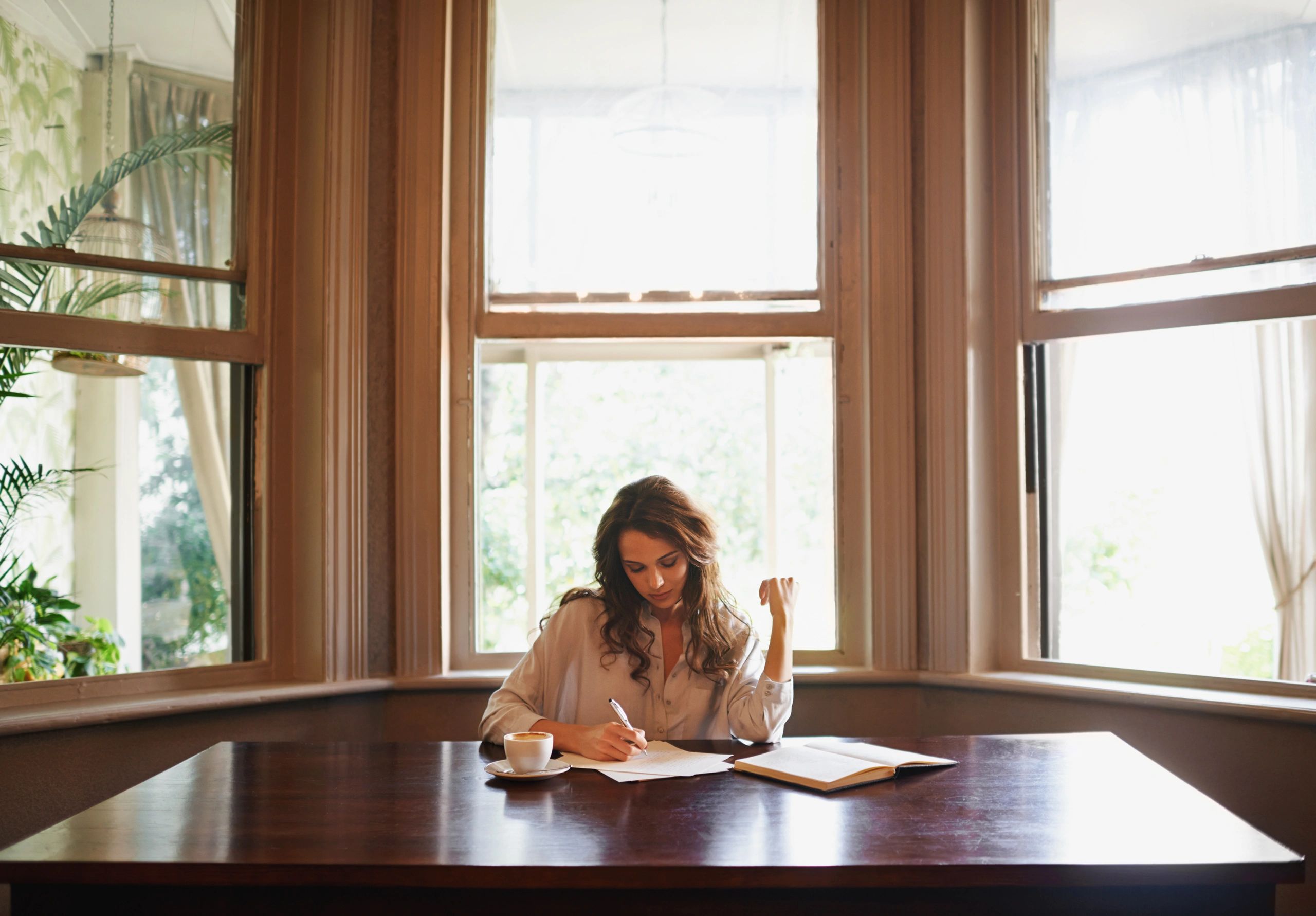 Author writing in a relaxed setting